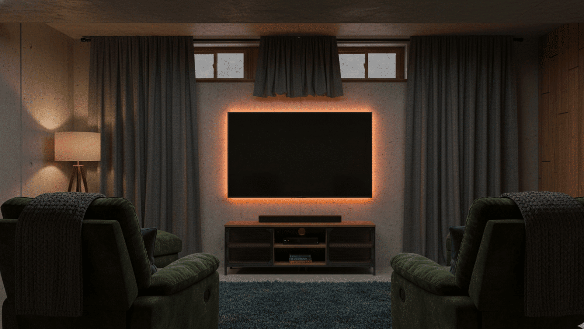 A backlit TV mounted below small basement windows with dark curtains and cozy seating.