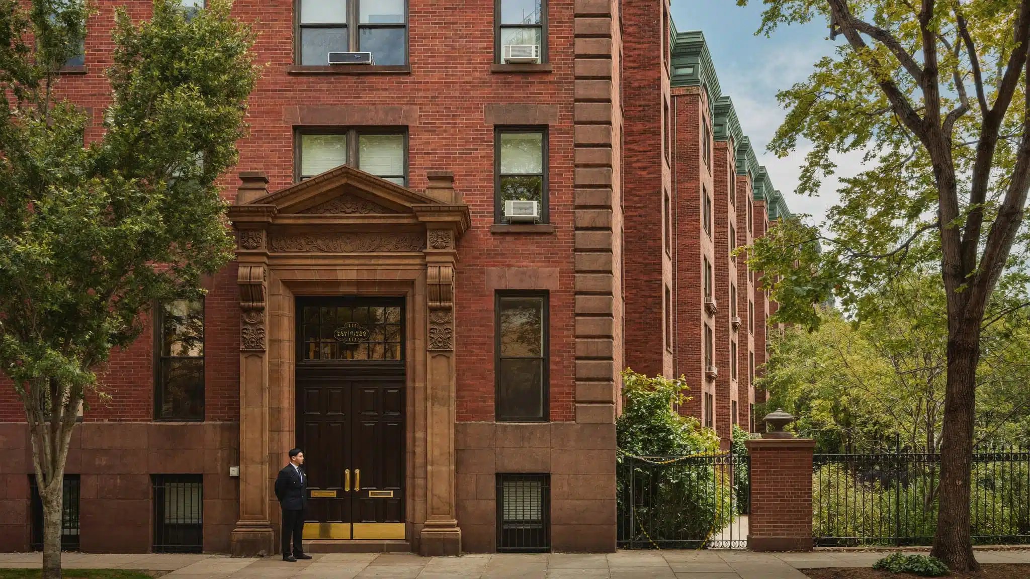 A historic brick co-op apartment building with ornate pre-war architecture.
