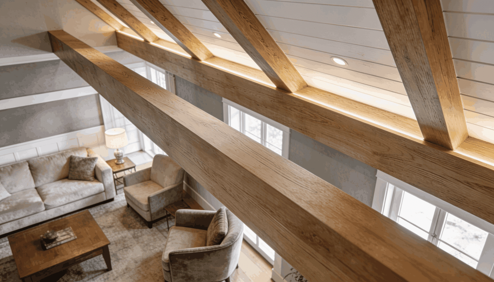 Close-up of faux wood ceiling beams with realistic texture in a vaulted living room ceiling.
