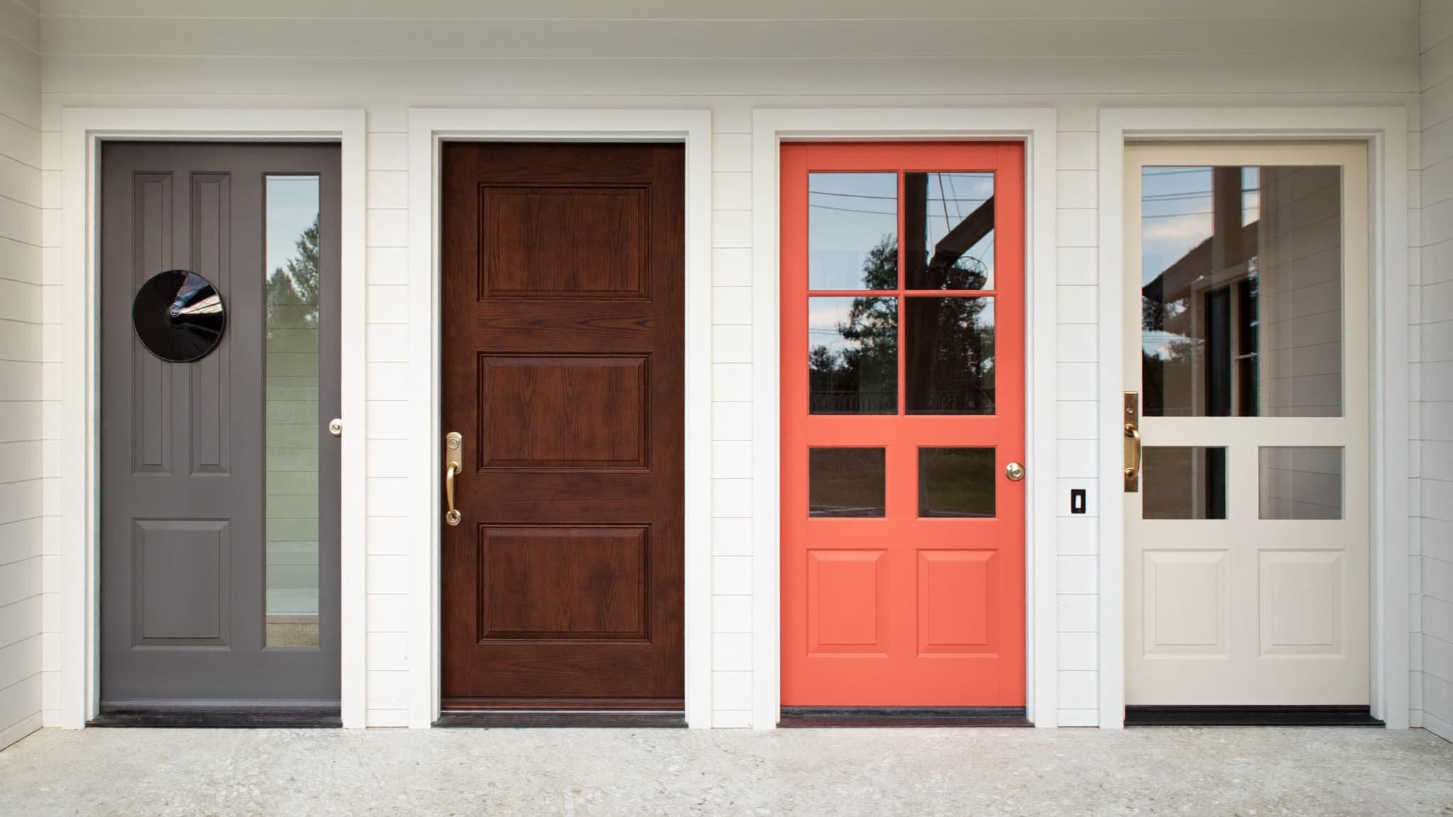 Four front door styles side-by-side: modern steel gray, classic dark brown wood, bold coral pink, and a traditional off-white storm door.