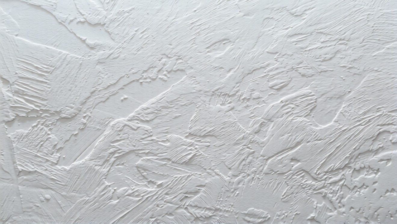 Hawk and trowel wall texture with layered, irregular plaster strokes and depth