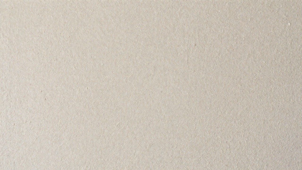 Smooth orange peel wall texture with subtle, fine dimples and evenly distributed pattern