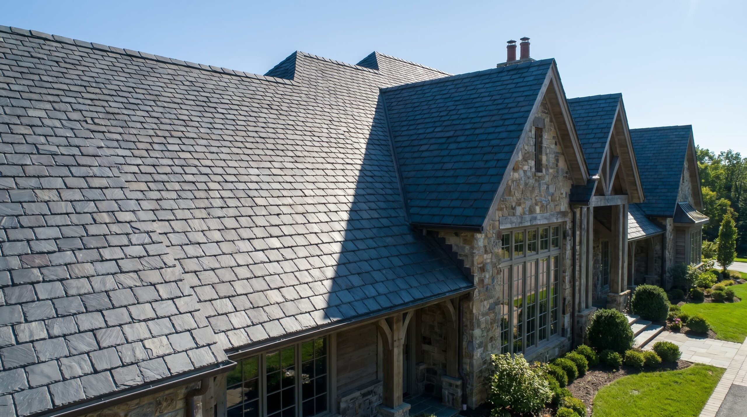 Close-up of slate roofing tiles highlighting natural stone texture and overlapping pattern