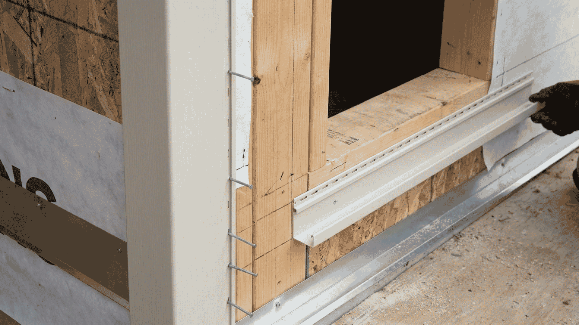 nstalling corner posts and J-channel around window