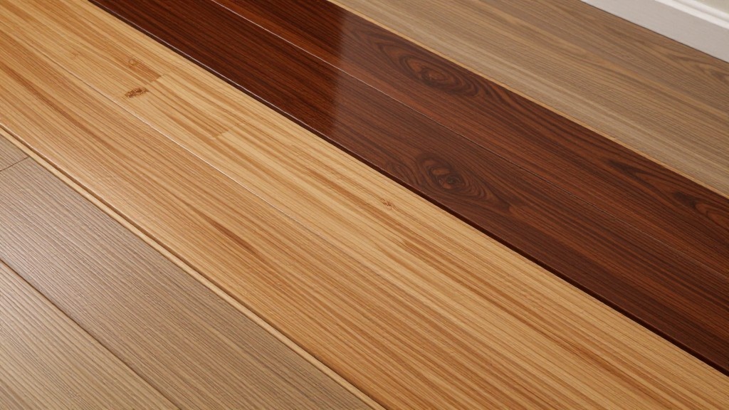 Side-by-side planks of wood flooring in four distinct shades, from light natural to dark brown.